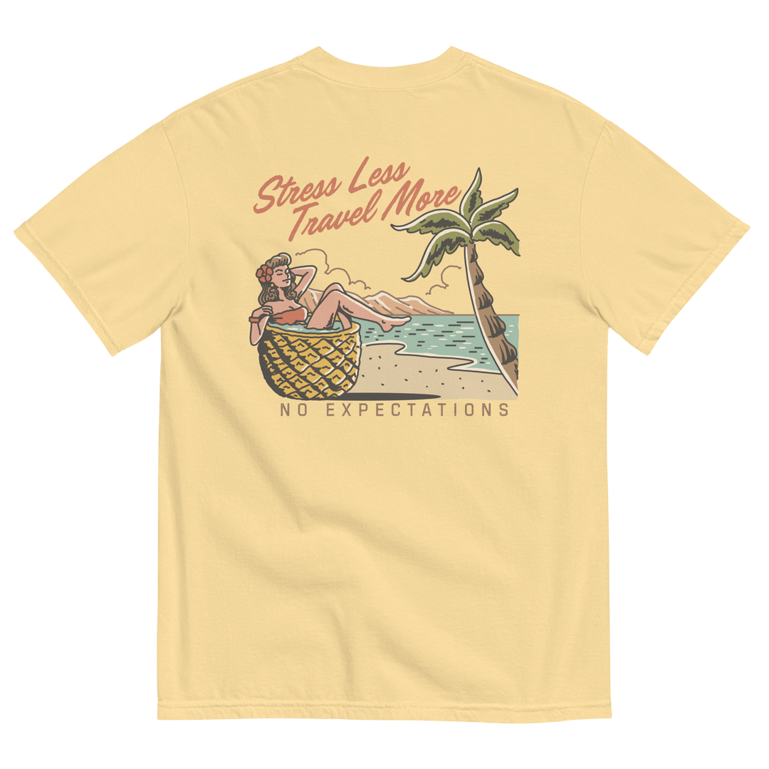 Soft and Durable Comfort Colors short sleeve t-shirt featuring a 'Stress Less - Travel More' design with a Pineapple Girl graphic, part of the No Expectations brand collection Butter