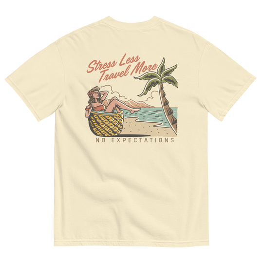 Soft and Durable Comfort Colors short sleeve t-shirt featuring a 'Stress Less - Travel More' design with a Pineapple Girl graphic, part of the No Expectations brand collection Ivory